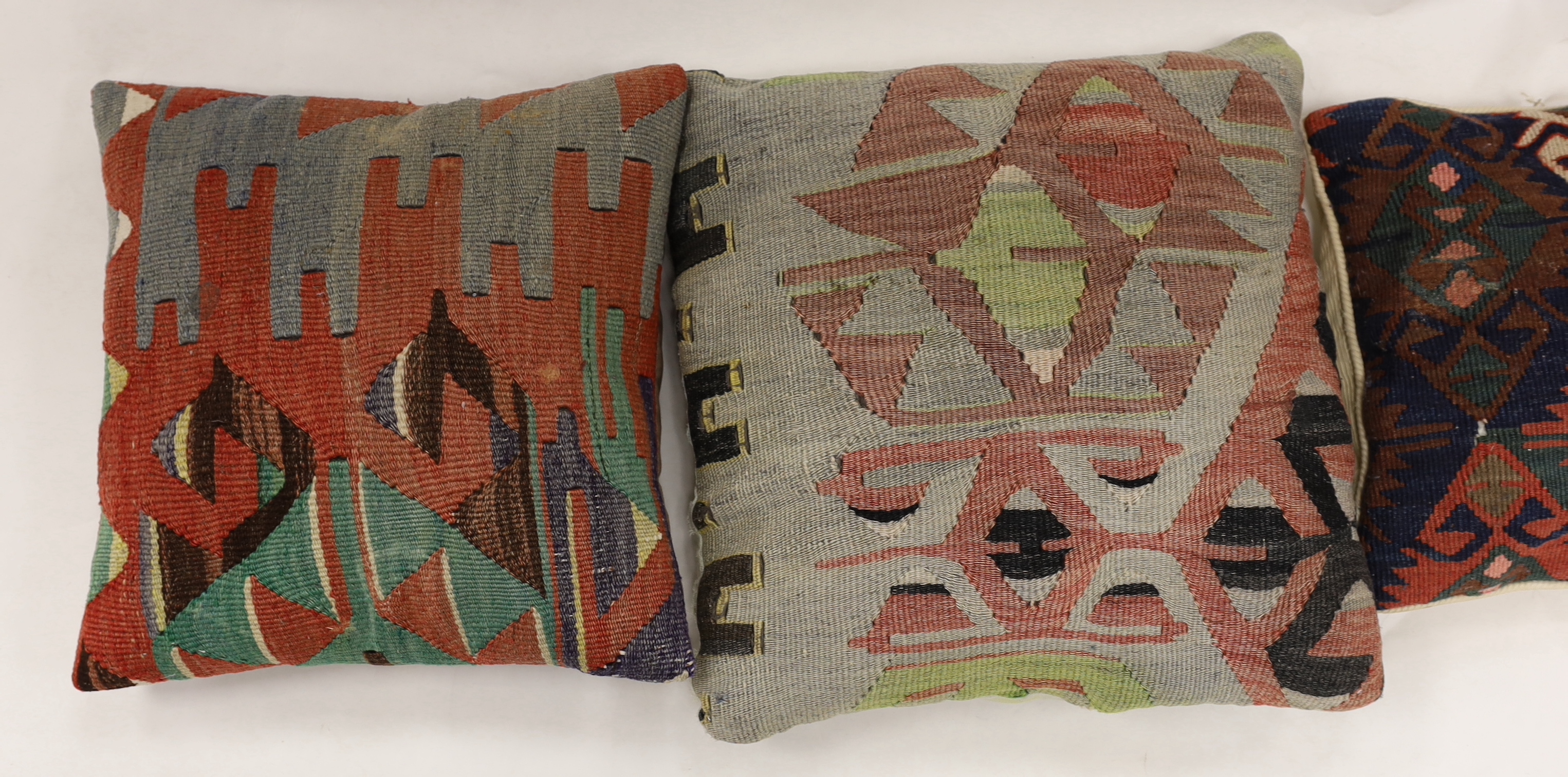 Four Kelim cushions, largest 43cm square